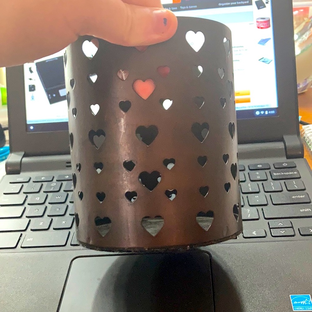 A pencil/candle holder
